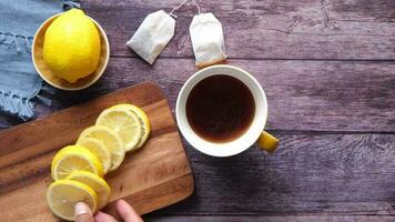 Making lemon tea on table, top view video
