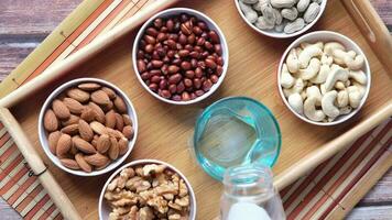 Peanut, hazelnut walnut , cashew nut and almond in a container video