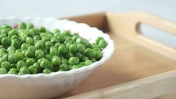 Fresh organic peas in a bowl video