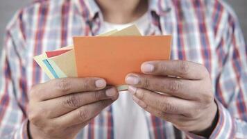 Close up of man hand reading a thank you letter video