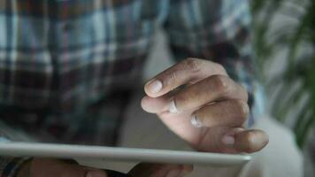 Close up of person hand analyzing bar chart on digital tablet video