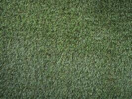 green synthetic grass texture background photo