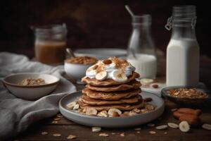 a stack whole wheat pancakes topped with sliced banana photo