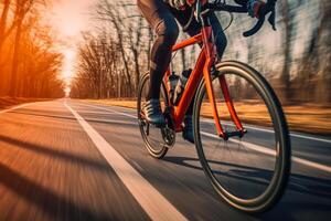 ciclista en un la carretera bicicleta paseos en un país la carretera en un soleado Mañana generativo ai foto