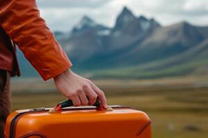 the traveler holds a suitcase in his hand against the backdrop of a beautiful mountain landscape, the concept of travel and active recreation generative ai photo