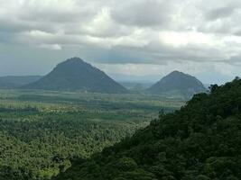 beautiful two mountains in between mountain range under the sky photo