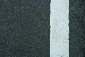 line background on black road surface photo
