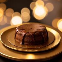 sackertorte. Chocolate cake on a golden plate. Coffee beans on a black textured table. photo