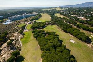 Aerial drone view of a golf course near Guincho in Cascais, Portugal photo