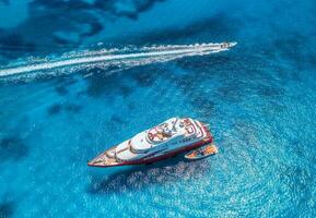 Aerial view of beautiful luxury yacht and boat in blue sea photo