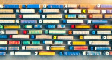 Aerial view of colorful trucks in terminal at sunrise in summer photo