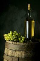 bottle of vine on wooden background photo