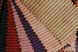 Close-up of colorful upholstery fabric samples. Textile texture background photo