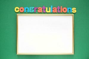 Colorful alphabet word Congratulations and frame on green background. Graduation concept. Primary school, high school, college, university graduation. Education card photo