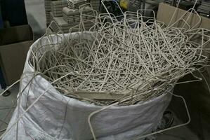 Waste pile for recycling on sorting plant. Technology reuse materials. Stack of shredded paper. Save the planet ecology concept. Industry reduced pollution factory photo