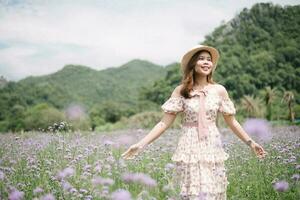 Young woman with bouquet in lavender field photo