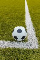 Soccer ball ,Football Artificial grass with white stripe photo