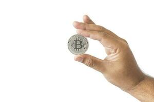 close-up hand of man holding crypto coin copy space isolated on white background. Blockchain technology finance in future. Male hand hold Bitcoin. concept about business, finance, trade, economy. photo