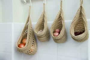 vegetable garlic onion hanger in white kitchen home apartment residential decoration interier design photo