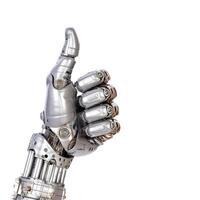 A robot hand giving thumbs up isolated on white background - photo