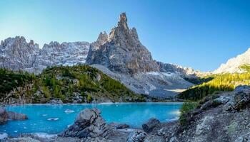 The frozen Sorapiss lake and majestic Dolomites Alp Mountains, province of Belluno, Italy photo