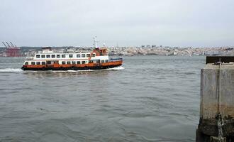 Old rusty ferry boat in Lisbon, Portugal photo