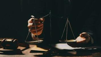 Justice and law concept.Male judge in a courtroom with the gavel, working with, computer and docking keyboard, eyeglasses, on table in morning light video