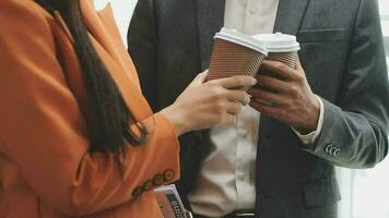 Financial analysts analyze business financial reports on a digital tablet planning investment project during a discussion at a meeting of corporate showing the results of their successful teamwork. video