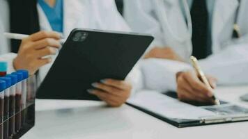 Team of doctors and businesswoman having a meeting in medical office video