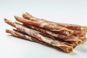 Tasty Italian Grissini with slices of jamon on white background, generate ai photo