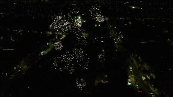 High Angle Footage of Live Fireworks over a Wedding Home at Luton City of England During Night. Illuminated City Was Captured with Drone's Camera on June 30th 2023 video