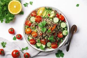 Quinoa tabbouleh salad with red cherry tomatoes, orange paprika, avocado, cucumbers and parsley. Traditional Middle Eastern and Arabic dish. White table background, top view, generate ai photo