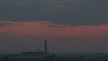 Beautiful pink cloudy sunset in the city, timelapse. Evening, nightfall video