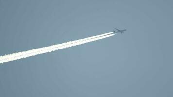 Widebody airplane flying at high altitude with contrail video
