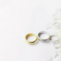 Wedding rings on wedding card on a white background, border design panoramic banner , generat ai photo