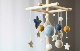 Baby crib mobile with stars, planets and moon. Kids handmade toys above the newborn crib. First baby eco-friendly toys made from felt and wood. Space for text, generate ai photo