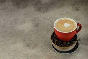 Cappuccino with Latte Art on Red Cup photo