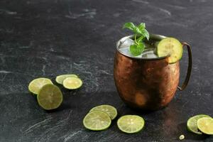 Moscow Mule Cocktail Served in Copper Mug with Ice photo