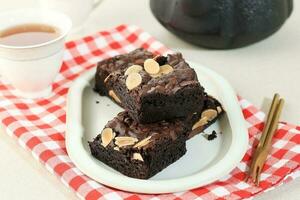 Brownie Butter Cake with Almond Slice and Chocolate Chips Topping photo