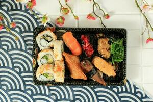 Top View Various Supermarket Sushi in Japanese Style Box, photo