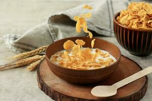 Cornflakes in Brown Bowl with Milk photo