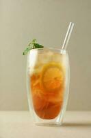 Cold Lemon Tea on Tall Double Wall Glass photo