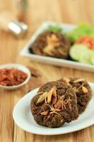 Empal or Gepuk is Indonesian Fried Meat photo