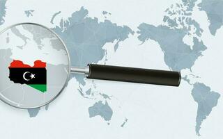 Asia centered world map with magnified glass on Libya. Focus on map of Libya on Pacific-centric World Map. vector