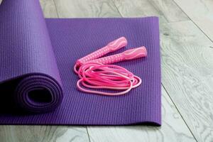 jump rope on a purple gymnastic mat photo