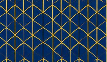 Argyle pattern. Navy blue with thin golden dotted line. Seamless dark background. photo