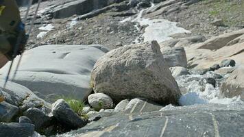 Caucasian Tourist Crossing Mountain Stream in Slow Motion video