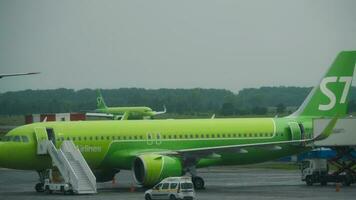 NOVOSIBIRSK, RUSSIAN FEDERATION JULY 24, 2021 - Passenger Airbus A320 of S7 Airlines slows down after landing at Tolmachevo International Airport video