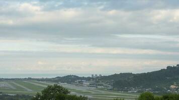 Timelapse of airport traffic. Panoramic view of the airfield. Clouds float over the city video