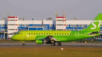 NOVOSIBIRSK, RUSSIAN FEDERATION JUNE 17, 2020 - Embraer E170SU, VQ BYW of S7 Airlines at the start of the runway at Tolmachevo Airport, Novosibirsk, side view. Tourism and travel concept video